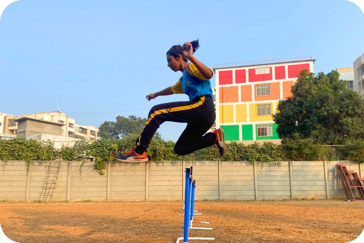 Walnut School student showcasing strength in outdoor hurdle race