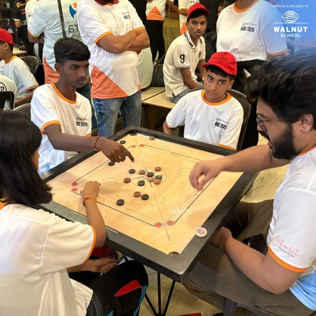Students playing carrom during inter-school RISE event at Walnut School